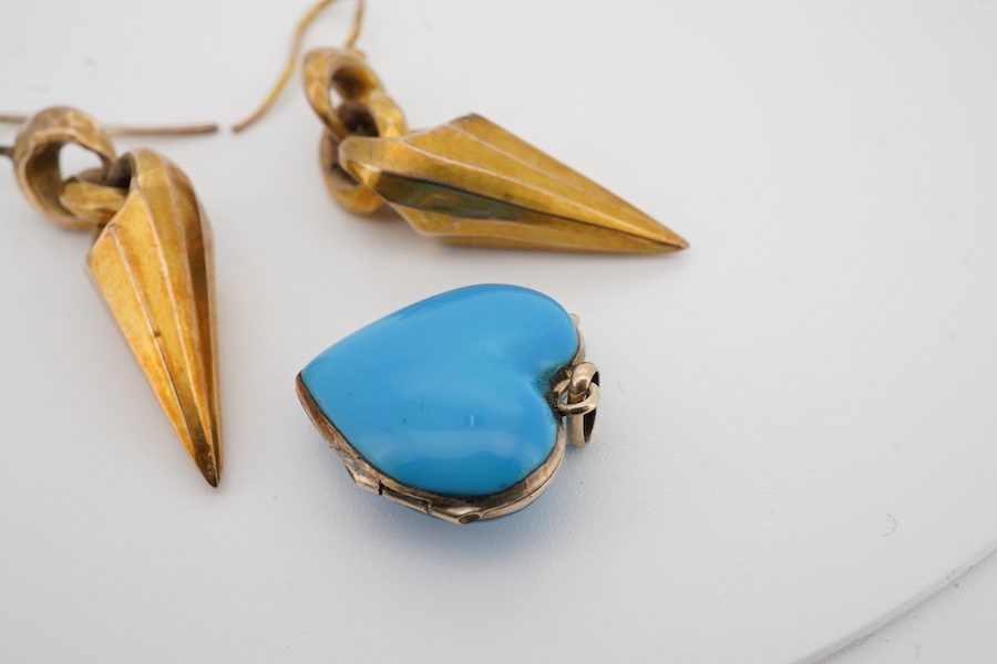 A pair of Victorian yellow metal drop earrings, 32mm excluding ear wire, together with a blue enamel and seed pearl set heart shaped locket(chip). Condition - poor